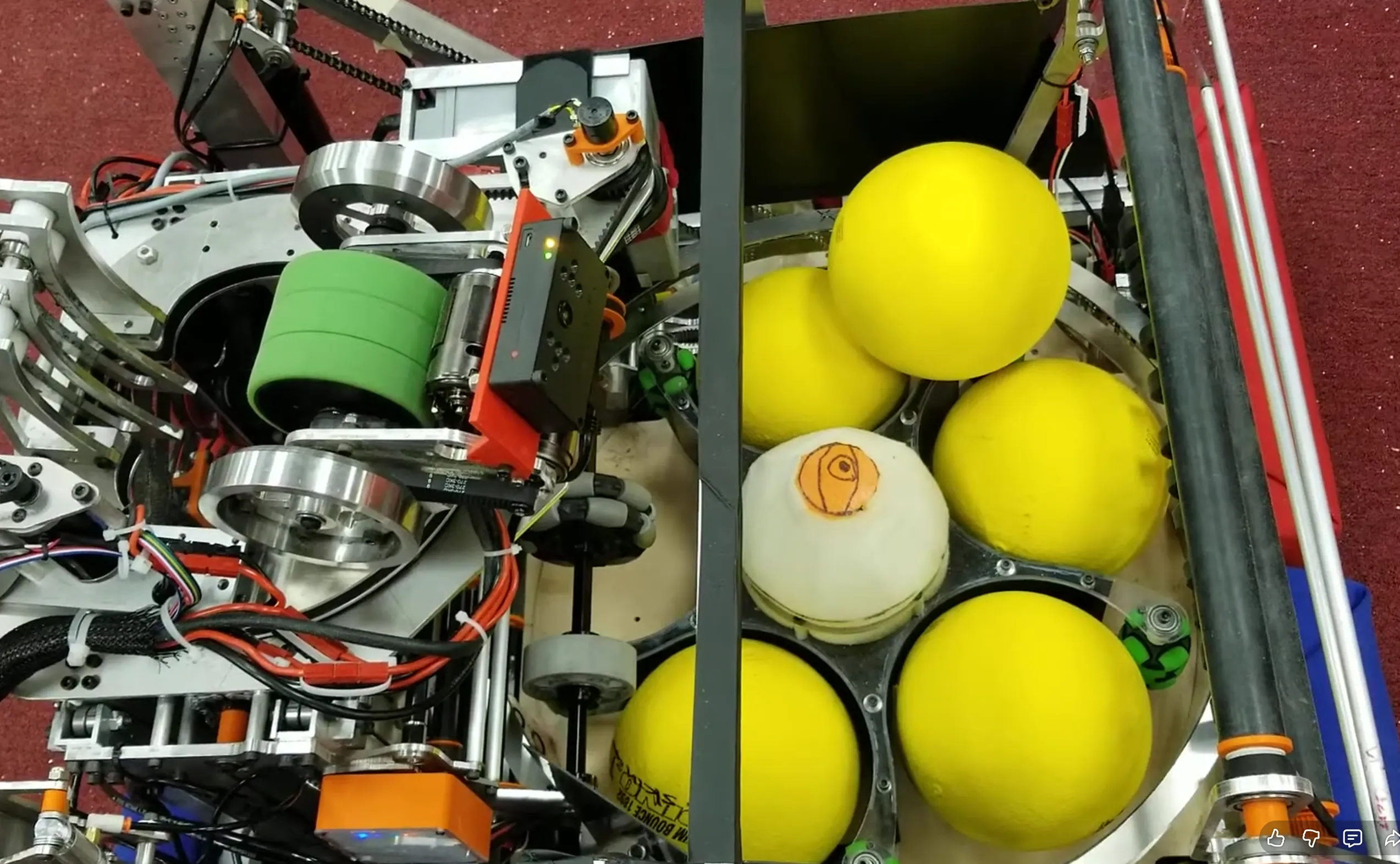 Close-up of FRC team 2073's 2020 robot showing a rotating multi-ball indexing mechanism