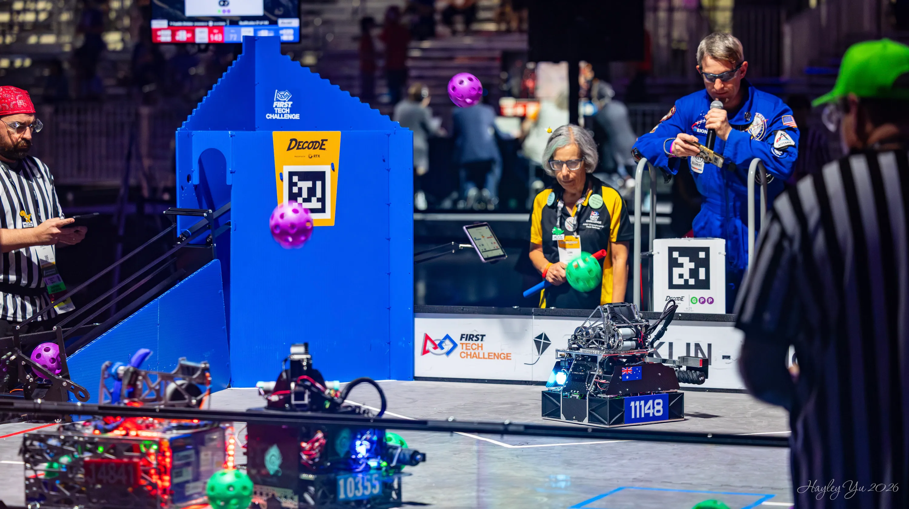 Barker Greybacks robot competing among other robots and game pieces on the Houston field